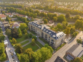 Residential building in urban neighbourhood, surrounded by autumnal trees and streets, Nagold,