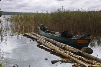Canoe by nature photographers at Lake Rätzsee, Müritz National Park, Mecklenburg-Western Pomerania,