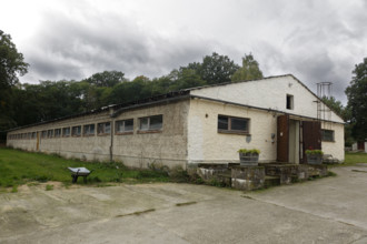 Indoor campsite in a former cattle shed at Fleether Mühle, Müritz National Park,