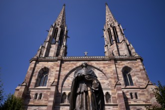 Monument, statue of Charles Emile Freppel, theologian and Bishop of Angers, in front of the church