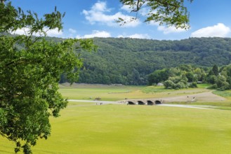 View of historic old bridge over river Eder has fallen completely dry during drought in old Eder