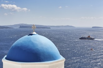Blue dome of an orthodox church, ferry crossing the sea, Caldera, Oia, Thira, Santorini, Cyclades,