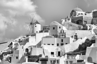 Typical cube-shaped holiday homes and windmill on a steep slope, Cumulus, monochrome, Oia, Thira,