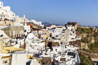 Tourists, crowd waiting for sunset in narrow alleys, Agios Nikolaos Castle, Oia, Thira, Santorini,