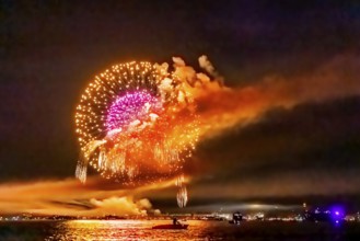 Lake Night Festival Constance. Water fireworks over the German shore and the neighbouring Swiss