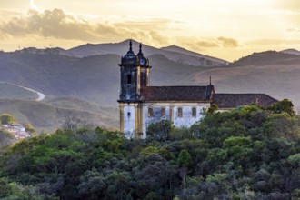 Mountains and baroque church at sunset in the historic city of Ouro Preto in Minas Gerais, Ouro