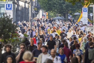 Crowd on the way in the shopping street. Königstraße pedestrian zone in Stuttgart,