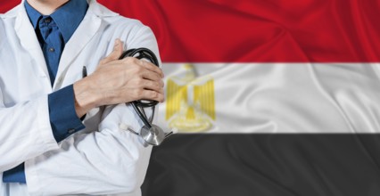 Doctor with stethoscope on Egypt flag. Doctor holding stethoscope on Egypt flag