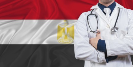 Male doctor with stethoscope on Egypt flag. Doctor holding stethoscope on Egypt flag