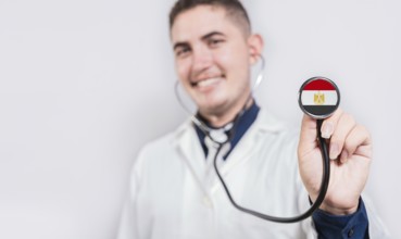Doctor showing stethoscope with Egypt flag. Egypt national healthcare concept