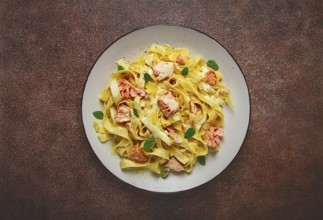 Tagliatelle pasta, in cream sauce with salmon, homemade, no people