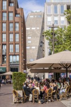 The Grote Markt in the old town of Groningen, modern facades of hotel and commercial buildings, in