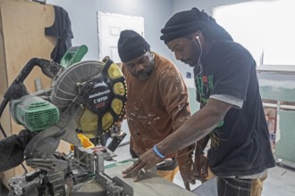 Detroit, Michigan - Workers remodel a house in the Morningside neighborhood that had been vacant