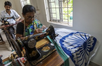Employees of the Assam Khadi and Village Industries Board stitching in a manufacturing unit of