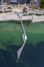Aerial view over Seebrücke, pier and sandy beach at seaside resort Haffkrug along the Baltic Sea,