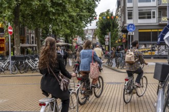 Cycling in the city centre of Groningen, old town, Netherlands