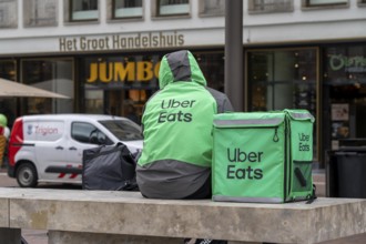 Bicycle transport in Groningen, Uber Eats, courier driver waiting for new orders, Netherlands