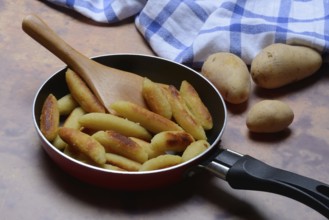 Fried puff noodles in a pan