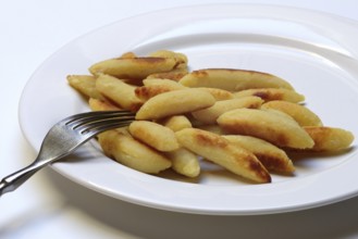 Fried puff noodles with fork on plate