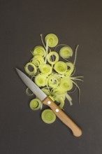 Leeks, leek rings with kitchen knife, sliced leek stalk, leek
