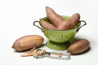 Sweet potato with potato peeler, Ipomoea batatas