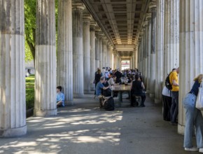 Tourists and passers-by in the colonnade courtyard of the Neues Museum, Bodestraße in Berlin Mitte,