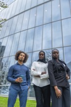 Group of young diverse business professionals standing with confident serious expressions in front