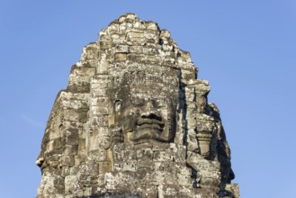 Huge stone-carved face of Bodhisattva Lokeshvara, also Avalokiteshvara, Bayon Temple, Angkor Thom,