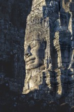 Huge stone-carved face of Bodhisattva Lokeshvara, also Avalokiteshvara, Bayon Temple, Angkor Thom,