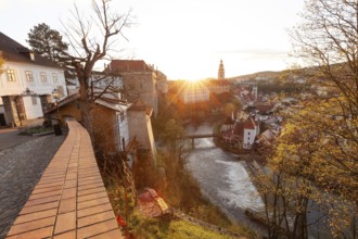 Spring morning sunrise with castle view over the rooftops of Krumlov in southern Bohemia, Czech