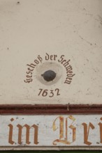 Old cannonball from 1632 in the wall of the bridge house on the Nahe bridge in Bad Kreuznach,