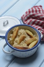 Fried puff noodles with sauerkraut in pots