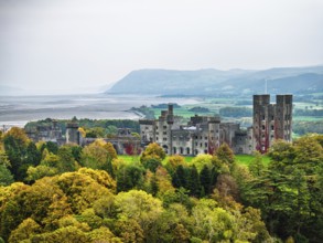 Autumn colours over Penrhyn Castle and Garden from a drone, Llandygai, Bangor, Gwynedd, North