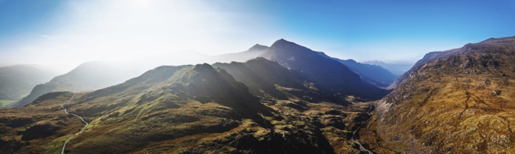 Autumn colours of Pen-y-Pass over Miner's Track, Start Point and road A4086 from a drone,