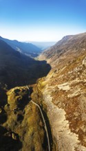 Autumn colours of Pen-y-Pass over Miner's Track, Start Point and road A4086 from a drone,