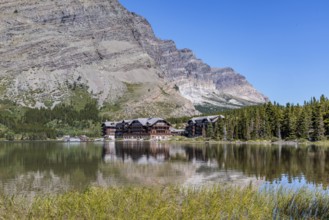 240831_319 Many Glacier Hotel at the bae of the mountains along the shoreline of Swiftcurrent Lake