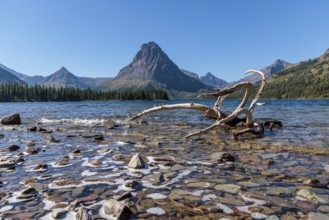 240906_146 Sinopah Mountain rises up behind Two Medicine Lake at the Two Medicine Ranger Station in