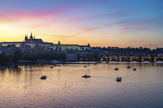 Sunset over the Vltava River, Charles Bridge and Prague Castle in Prague, Czech Republic