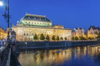 Vltava embankment with the Academy of Arts, Architecture and Design at dusk, Prague, Czech Republic