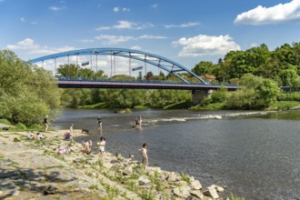 Children playing on the Berounka river in Dobrichovice, Czech Republic