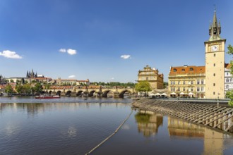 City view of Prague with Vltava River, Old Town Water Tower, Novotný Bridge, Castle and Charles