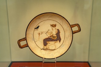 Plate Apollo and the Raven in the Archaeological Museum of Delphi, UNESCO World Heritage Site in
