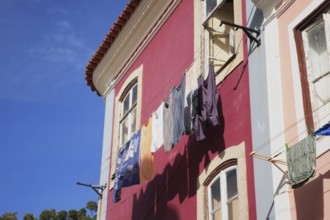 Laundry is dried on a line in front of a house in the spa town of Monchique, Algarve, Portugal