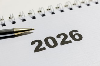 Ringbook calendar, calendar sheet for the year 2026 with a black pen next to it