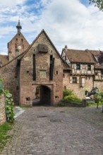 The entrance portal on the city wall of the historic town of Riquewihr, Ellsass