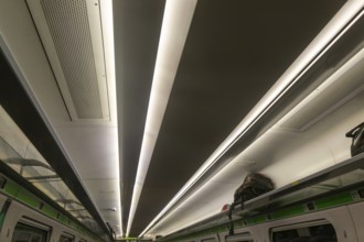 Pattern formed by stripes of ceiling lighting inside GWR InterCity Express train carriage, UK