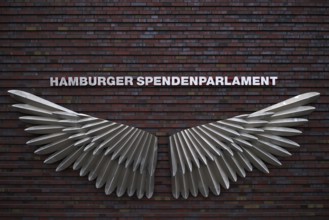 Exterior photo logo, wing, swing, Hamburg donation parliament, lettering, façade, warehouses, brick