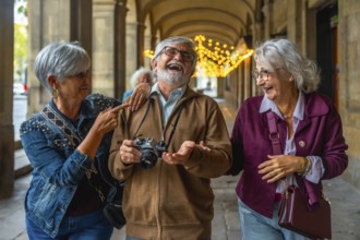 Group of excited senior friends enjoying their city trip, laughing and walking together in an