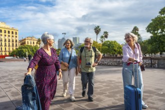 Group of senior friends happily walking together through a city exploring new destinations,