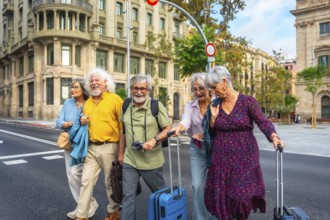 Smiling group of senior friends exploring a european city on vacation, crossing a busy street with